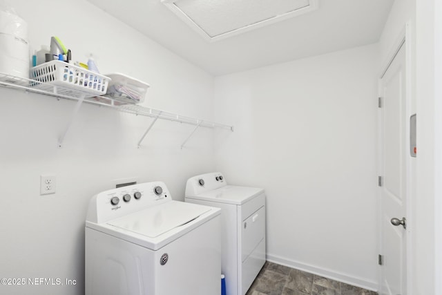 laundry room with baseboards, separate washer and dryer, attic access, and laundry area