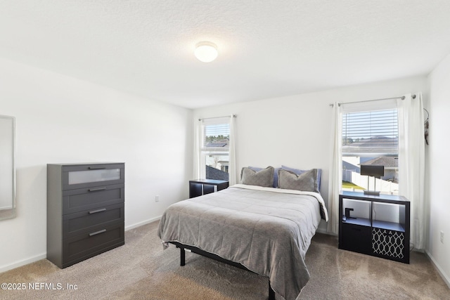 carpeted bedroom with baseboards
