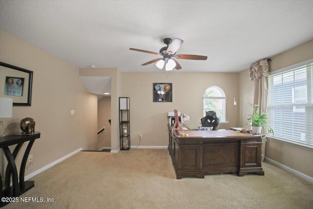 1074 Spanish Bay Ct, Orange Park, FL 32065 - office area with baseboards, a textured ceiling, ceiling fan, and light colored carpet