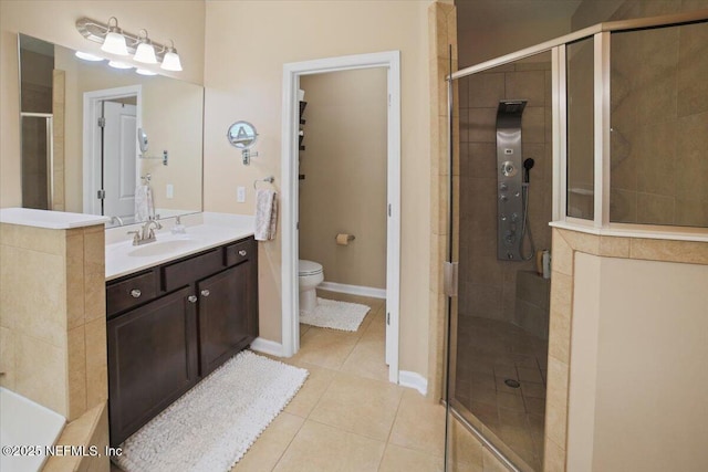 1074 Spanish Bay Ct, Orange Park, FL 32065 - bathroom with vanity, toilet, baseboards, a shower stall, and tile patterned floors