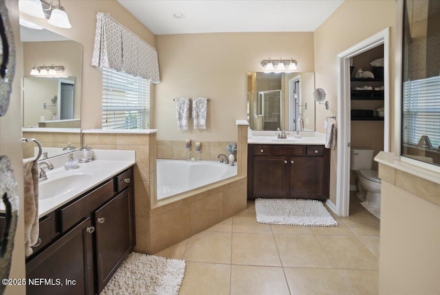 1074 Spanish Bay Ct, Orange Park, FL 32065 - full bath featuring a stall shower, tile patterned flooring, a sink, and a garden tub
