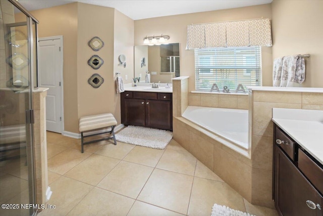 1074 Spanish Bay Ct, Orange Park, FL 32065 - bathroom featuring tile patterned flooring, vanity, a stall shower, and a bath