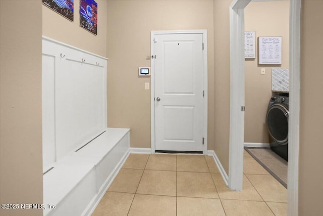 1074 Spanish Bay Ct, Orange Park, FL 32065 - mudroom with washer / clothes dryer, baseboards, and light tile patterned flooring
