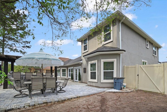 1074 Spanish Bay Ct, Orange Park, FL 32065 - rear view of house with a gate, a patio area, french doors, stucco siding, and fence