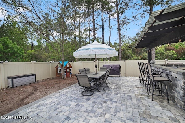 1074 Spanish Bay Ct, Orange Park, FL 32065 - view of patio / terrace featuring outdoor dining area, a fenced backyard, and outdoor dry bar