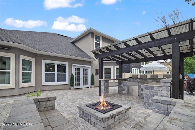 1074 Spanish Bay Ct, Orange Park, FL 32065 - view of patio featuring a fire pit, french doors, an outdoor kitchen, and a pergola