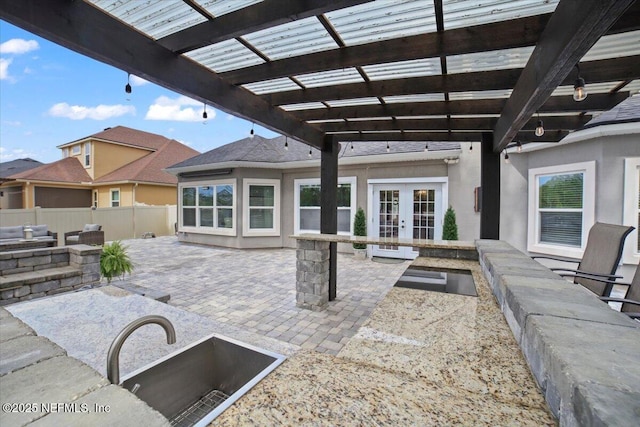 1074 Spanish Bay Ct, Orange Park, FL 32065 - view of patio with french doors, a pergola, and fence