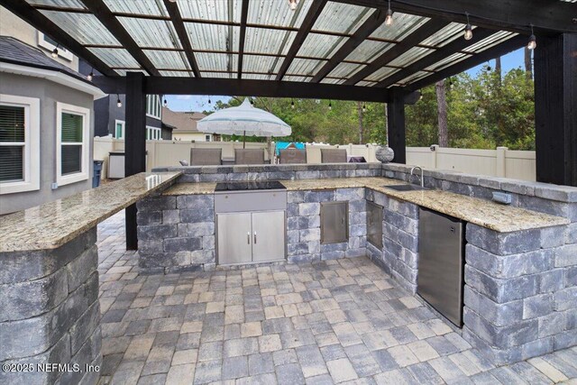 1074 Spanish Bay Ct, Orange Park, FL 32065 - view of patio / terrace featuring a fenced backyard, a sink, area for grilling, and outdoor wet bar