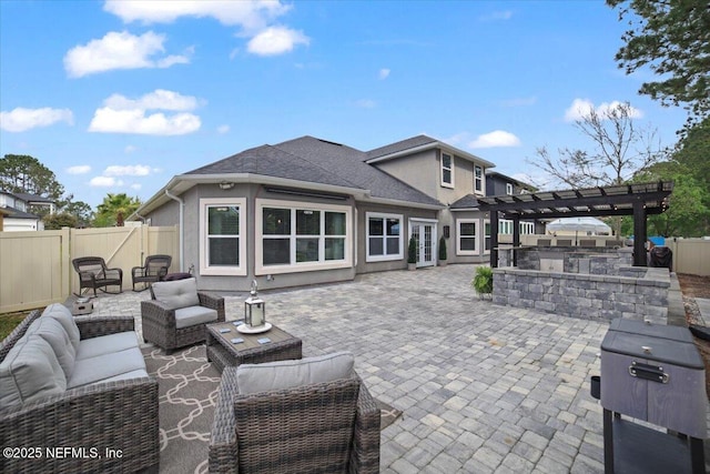 1074 Spanish Bay Ct, Orange Park, FL 32065 - view of patio featuring outdoor lounge area, a fenced backyard, an outdoor kitchen, and french doors