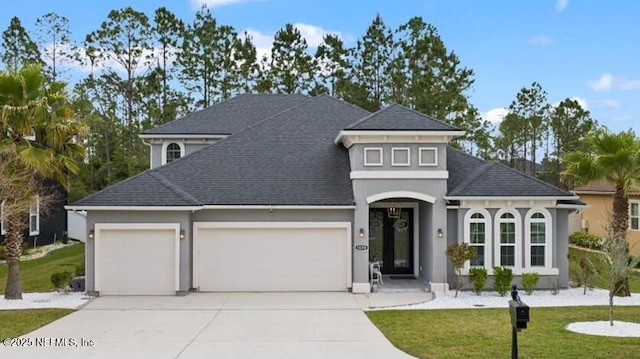 1074 Spanish Bay Ct, Orange Park, FL 32065 - view of front facade featuring a front lawn, driveway, an attached garage, and roof with shingles