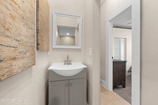 3824 Springfield Blvd, Jacksonville, FL 32206 - bathroom featuring vanity, crown molding, a textured wall, and tile patterned floors