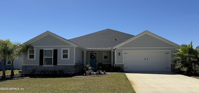 665 Flach Dr, Saint Johns, FL 32259 - craftsman-style house featuring a garage, concrete driveway, a front lawn, and stone siding