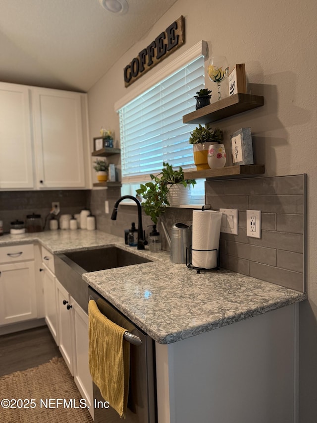 665 Flach Dr, Saint Johns, FL 32259 - kitchen featuring open shelves, a sink, backsplash, stainless steel dishwasher, and lofted ceiling