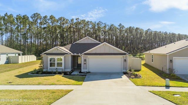 ranch-style home featuring a front lawn, concrete driveway, fence, and an attached garage