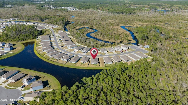 aerial view with a residential view, a water view, and a wooded view