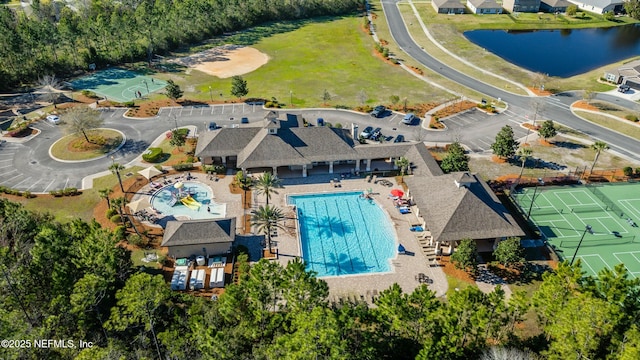 birds eye view of property featuring a water view