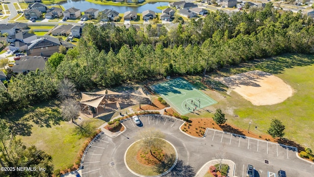 aerial view featuring a residential view and a water view