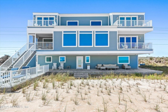 rear view of property with a patio area