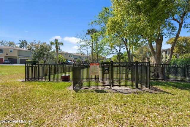 view of yard with fence and a residential view