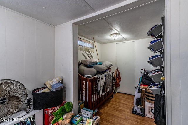 19040 Waterville Rd, Jacksonville, FL 32226 - bedroom featuring wood finished floors and a textured ceiling
