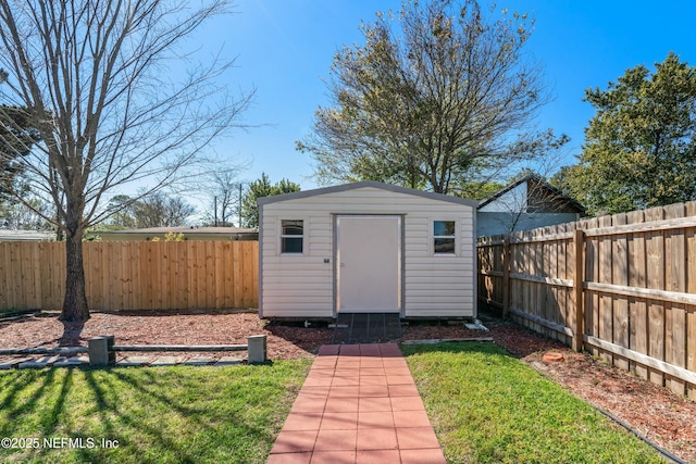 view of shed with a fenced backyard