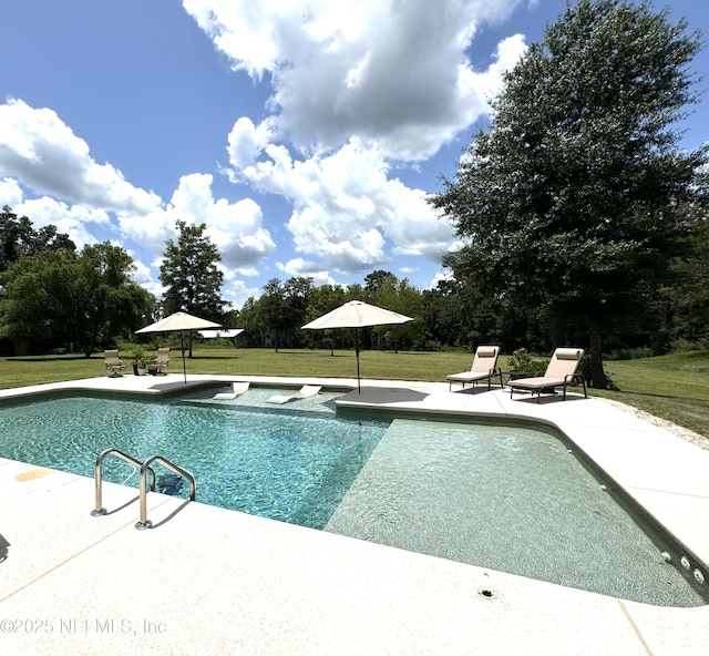 outdoor pool featuring a patio and a yard