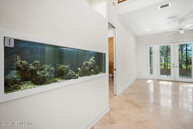hall featuring visible vents, french doors, crown molding, and baseboards