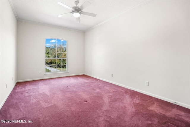 spare room with baseboards, carpet floors, ceiling fan, a textured ceiling, and crown molding