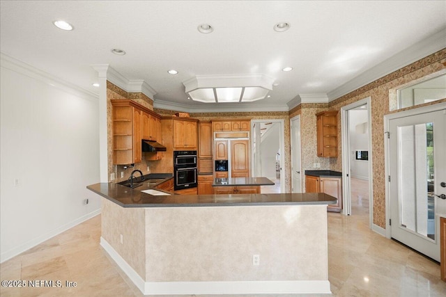 kitchen with paneled fridge, dobule oven black, open shelves, under cabinet range hood, and crown molding