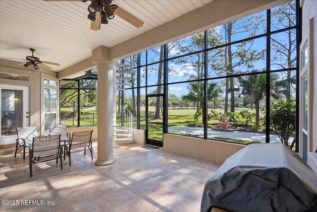 sunroom / solarium featuring ceiling fan