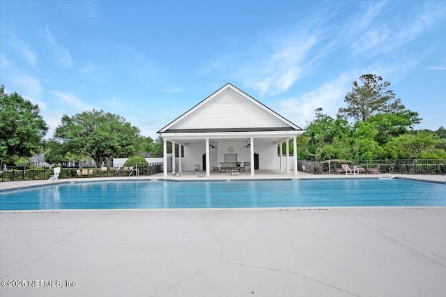 pool featuring a patio and fence