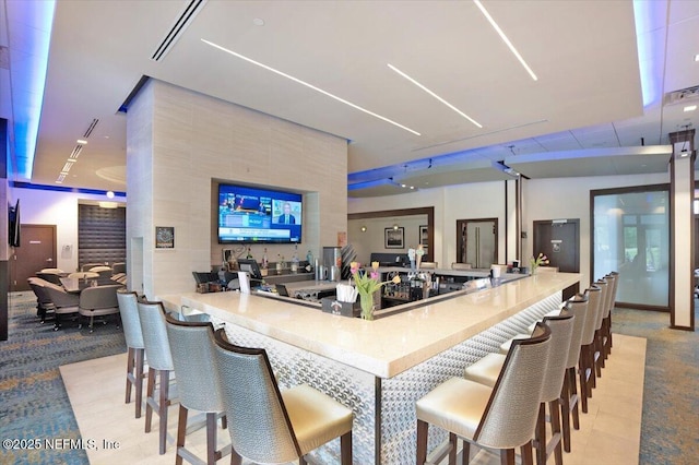 bar with visible vents and carpet flooring