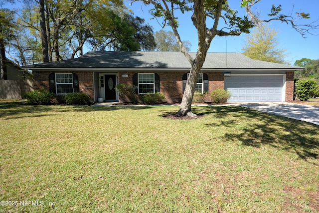 ranch-style home with a garage, a front yard, concrete driveway, and brick siding