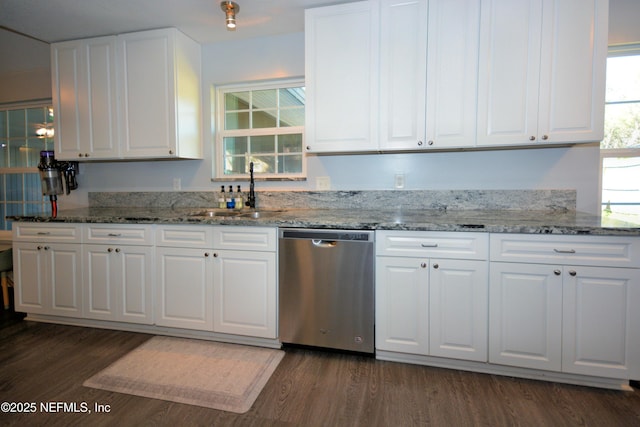 kitchen featuring stainless steel dishwasher, dark wood-type flooring, white cabinetry, and a sink