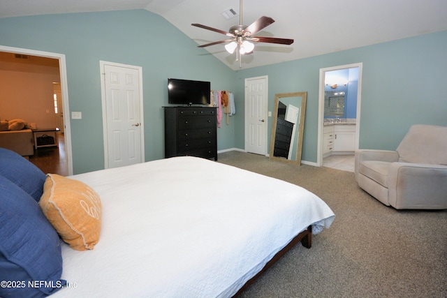 bedroom with ceiling fan, ensuite bath, visible vents, carpet flooring, and lofted ceiling
