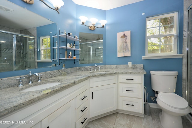 bathroom with a sink, visible vents, and a wealth of natural light