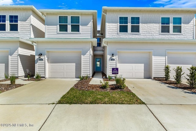 multi unit property featuring driveway