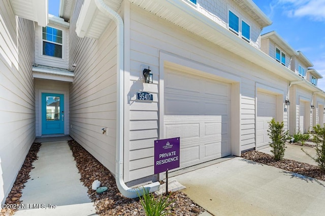 property entrance featuring driveway