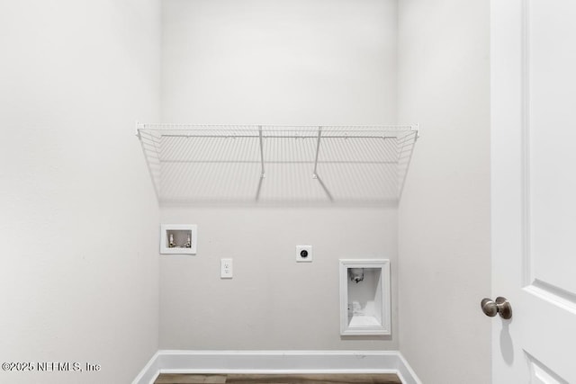 clothes washing area featuring laundry area, hookup for an electric dryer, baseboards, and washer hookup