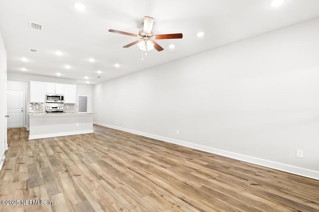 unfurnished living room featuring light wood finished floors, visible vents, baseboards, ceiling fan, and recessed lighting