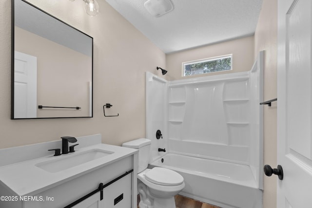 bathroom featuring toilet, shower / washtub combination, wood finished floors, and vanity