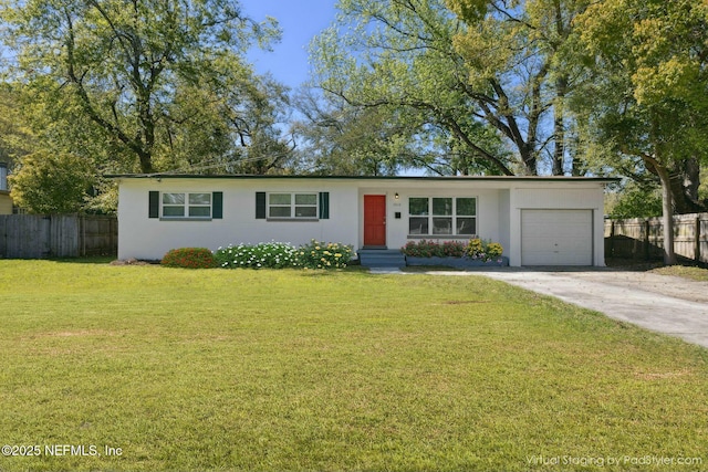 ranch-style house with a front yard, concrete driveway, stucco siding, fence, and an attached garage