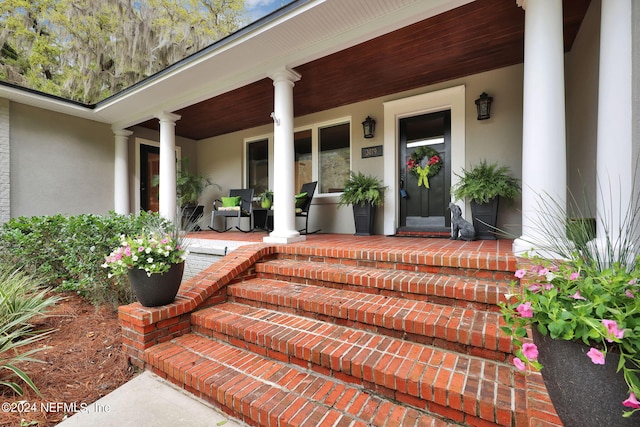 3079 Anderson Rd, Green Cove Springs, FL 32043 - entrance to property featuring stucco siding and covered porch