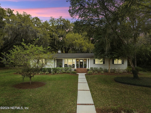 3079 Anderson Rd, Green Cove Springs, FL 32043 - view of front of property with covered porch, a chimney, and a front yard