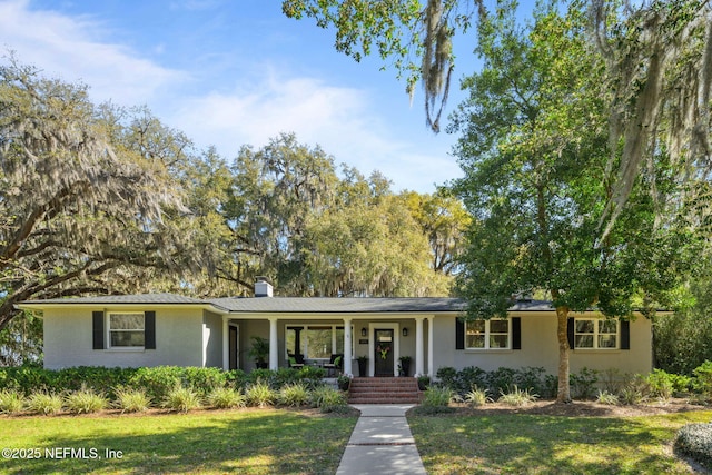 3079 Anderson Rd, Green Cove Springs, FL 32043 - ranch-style house featuring covered porch and a front lawn