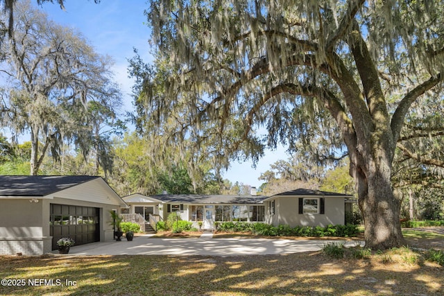 3079 Anderson Rd, Green Cove Springs, FL 32043 - ranch-style house featuring concrete driveway and an attached garage