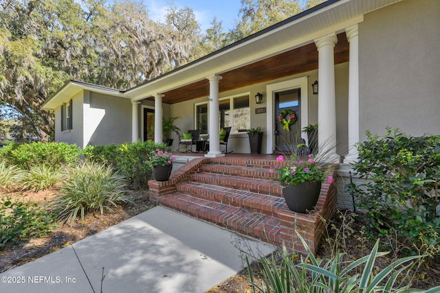 3079 Anderson Rd, Green Cove Springs, FL 32043 - property entrance featuring stucco siding and covered porch
