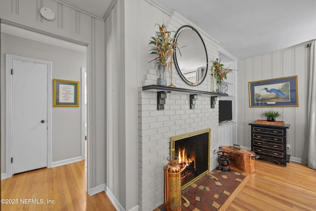 3079 Anderson Rd, Green Cove Springs, FL 32043 - living room with a fireplace, light wood-style floors, and baseboards