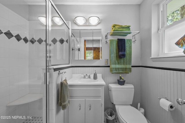 3079 Anderson Rd, Green Cove Springs, FL 32043 - full bath featuring vanity, a shower stall, toilet, and a wainscoted wall