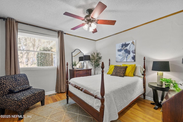 3079 Anderson Rd, Green Cove Springs, FL 32043 - bedroom featuring visible vents, crown molding, baseboards, wood finished floors, and a textured ceiling